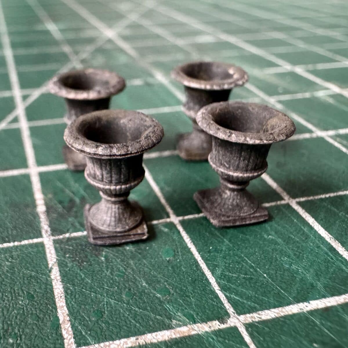 Miniature model cast iron urns