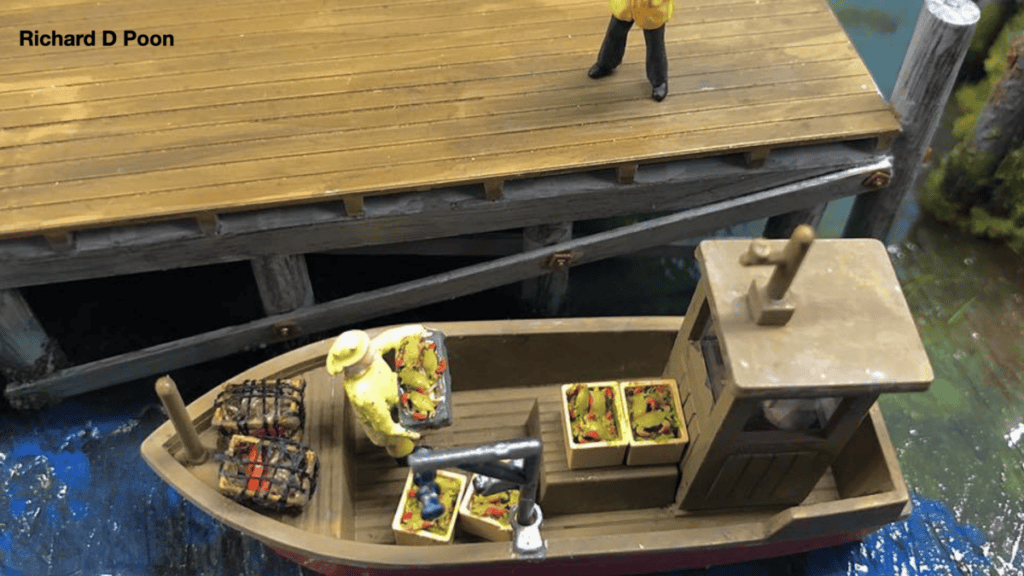 Miniature model railroad detail like crabs on a fishing boat really bring a scene to life