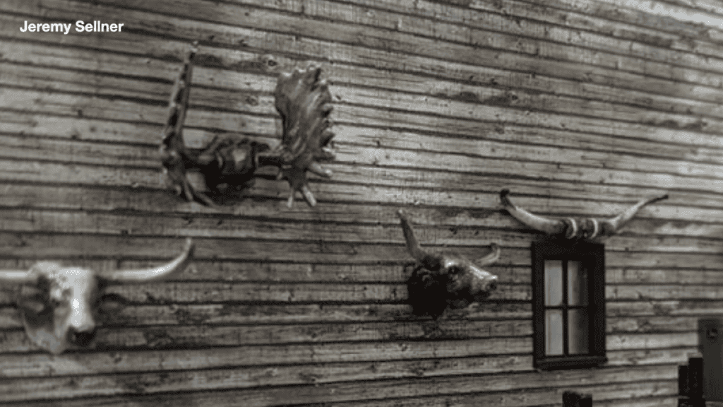 Miniature model railroad details of hunting trophies on a wall